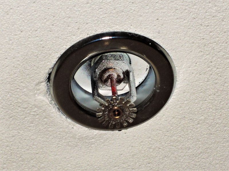 Not all fire sprinklers are the same — and neither are the buildings they protect. Elite Systems Inc. provides expert solutions across multiple types of sprinkler systems, customized for your environment: Wet Pipe Systems: These systems are the most common, using water from the building’s supply to quickly activate when heat triggers the sprinkler head. Ideal for offices and commercial buildings where freezing isn’t a concern. Dry Pipe Systems: Perfect for unheated or high-hazard environments, these systems use pressurized air until the sprinkler system activates, minimizing water damage in sensitive areas. Pre-Action Sprinkler Systems: Common in data centers and high-rise structures where water is not contained in the pipes until the system is heat-activated. Deluge Systems: Designed for high-risk or chemical plants, these systems release water is discharged through open sprinkler heads when a fire alarm is triggered. Deluge systems are installed where rapid active fire control is critical. Whether installing fire sprinkler systems for a small office or large commercial facilities, our experts ensure every pipe, valve, and sprinkler head functions perfectly.